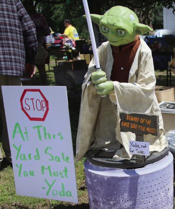 Thousands of yard sale shoppers . ocked to the Cimarron Valley this past weekend for the 100-mile yard sale Friday May 3, and Saturday May 4. This sale in Drumright boasted Star-Wars themed signage to attract customers. Photo by Allie Prater