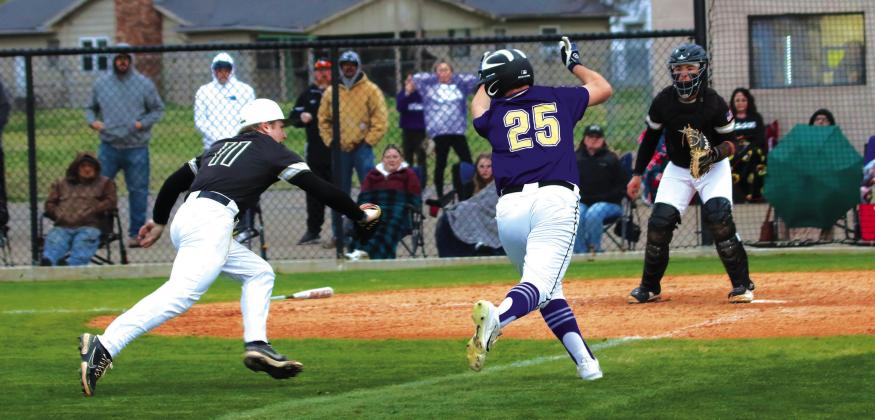 Pirate Colton Wofford gets caught in a squeeze play at the plate.
